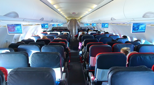 airplane interior - people sitting on seats